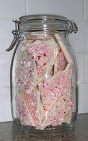 storing candy white peppermint bark in glass jar
